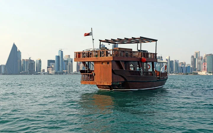 Wooden dhow cruise with view of Doha skyline in background