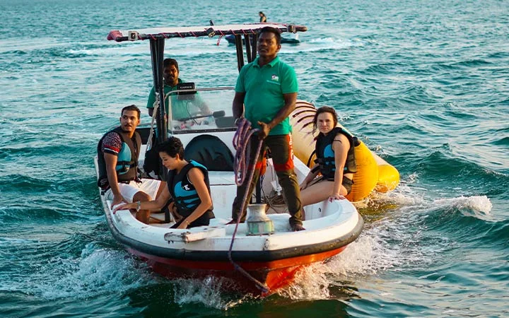 Guests on speed boat during Dhow Cruise & Water Sports Package in Qatar