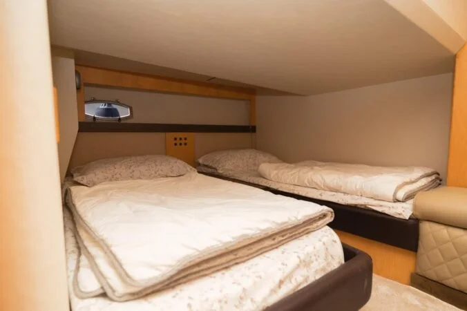 Cozy bedroom cabin inside a luxury yacht rental in Qatar