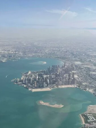 Clear aerial photo of Doha city skyline from Piper Archer flight