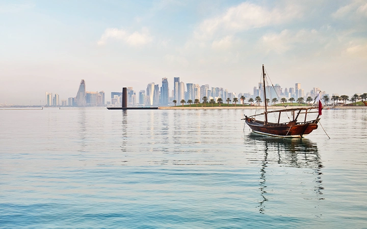 Doha Scenic Cruise dhow reflecting skyline on calm sea