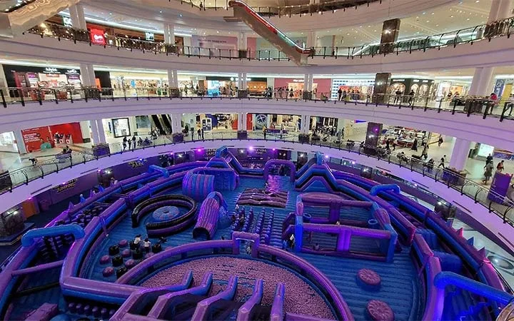 Inside City Center Mall Doha showing shops and family entertainment zone