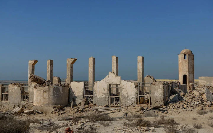 Stone pillars at Al Areesh Ghost Town Qatar showing abandoned architecture