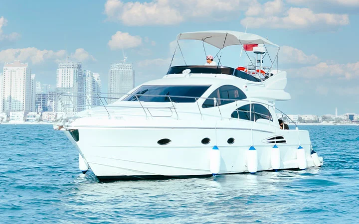 White private luxury yacht sailing in Doha Qatar for up to 12 passengers