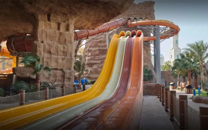 Colorful multi lane slides at Desert Falls Water & Adventure Park Qatar
