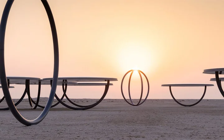 Sunset view with circular sculptures at Ain Mohamed Village Qatar